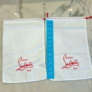 Two cloth bags from Christian Louboutin.